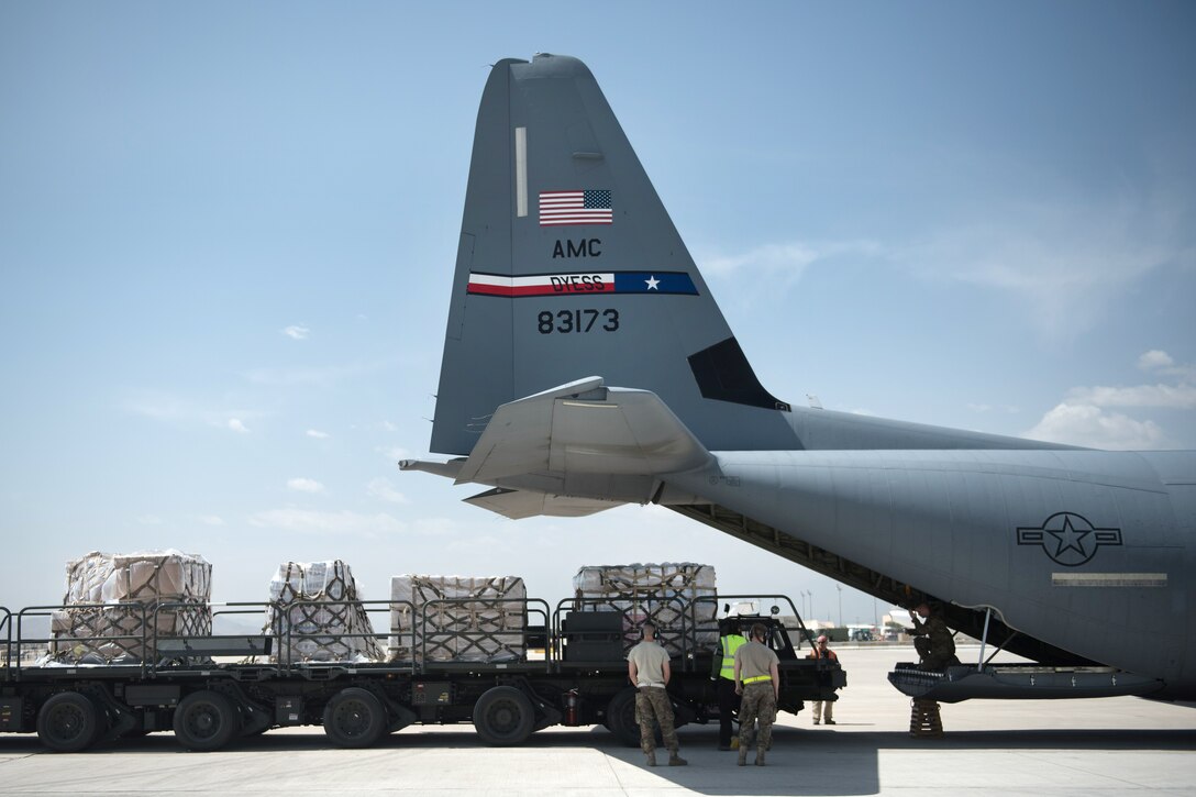 Airmen prepare to load cargo onto a C-130J Super Hercules aircraft at Bagram Airfield, Afghanistan, May 5, 2017. The airmen are deployed from Dyess Air Force Base, Texast. Air Force photo by Staff Sgt. Benjamin Gonsier