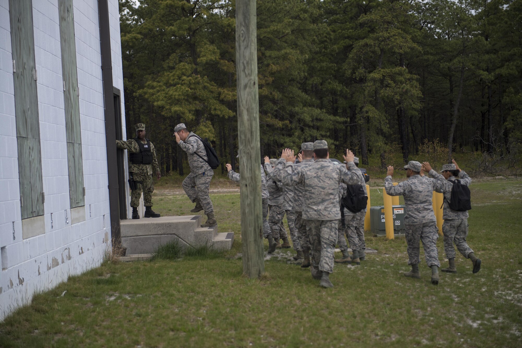 Released hostages are moved to a secure area during an active shooter exercise on Joint Base McGuire-Dix-Lakehurst, N.J. May 2. This exercise included a realistic and ambitious hostage negotiation scenario and exercised extended consequence management into Casualty Affairs and Next-of-Kin notification.  Four USAF commanders and NoK teams were dispatched to conduct simulated deceased members’ Next of Kin notifications.