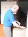 Rob Altland unpacks amid moving boxes in his family’s garage on the west side of Tinker Air Force Base. The Altland family recently took advantage of Rob’s Air Force retiree status to qualify for base housing under expanded eligibility rules. (Air Force photo by John Parker)