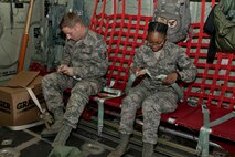 U.S. Air Force Reserve Staff Sgt. Justin Blattner, education and training manager, 913th Force Support Squadron and Airman 1st Class Jaylin Jones, customer service journeyman, 913 FSS, buckle into a C-130J Super Hercules for an orientation flight host by the 913th Airlift Group May 6, 2017, at Little Rock Air Force Base, Ark. The flight allowed the Airmen the opportunity to observe what aircrews do during the air operations they support from the ground. (U.S. Air Force photo by Master Sgt. Jeff Walston/Released)
