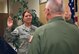 Tech. Sgt. Ginger Stewart, command post operator, 932nd Airlift Wing, recites the oath of enlistment administered by Col. Jonathan Philebaum, commander, 932nd AW, May 6, 2017, Scott Air Force Base, Illinois.  
