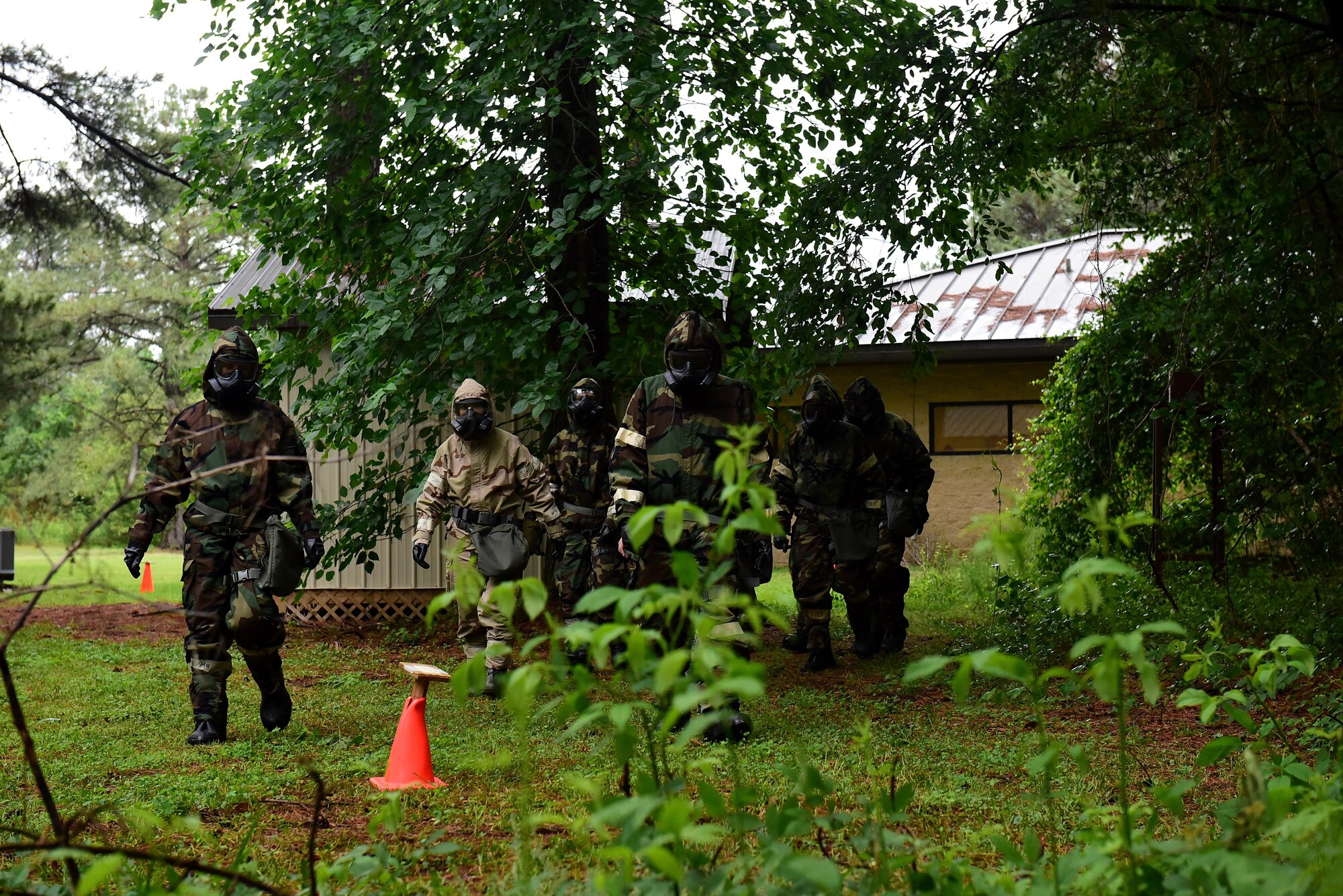 Airmen in a chemical, biological, radioactive, and nuclear hands-on course practice a post-attack reconnaissance sweep, May 2, 2017, at Seymour Johnson Air Force Base, North Carolina. Airmen who are scheduled to deploy are required to complete the course prior to departing their duty station. (U.S. Air Force photo by Airman 1st Class Kenneth Boyton)