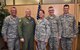 Tech. Sgt. Ginger Stewart, center, along with Col. Jonathan Philebaum, commander, flight suit, pose with 932nd command post operators after Stewart's re-enlistment by Philebaum, May 6, 2017, Scott Air Force Base, Illinois.  Stewart said that she was honored to have Philebaum administer the oath and looks forward to continuing to work in such a great environment.  (U.S. Air Force photo by Tech. Sgt. Christopher Parr)