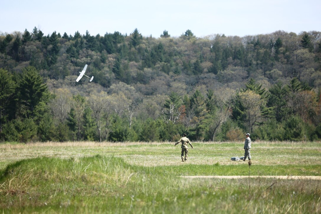 Service members at Fort McCoy for training in the 86th Training Division’s Warrior Exercise 86-17-02 practice flying an unmanned aerial vehicle at Warrens Drop Zone on North Post during exercise operations May 4, 2017, at Fort McCoy, Wis. Nearly 6,000 Soldiers participated in the Warrior Exercise that focuses on realistic and austere operational environments. The exercise is aimed at testing and developing leaders at every echelon. One of the key objectives for the 2017 Warrior Exercise was to enable units at the platoon level to succeed in a tactical environment when faced with the stressors of combat. (U.S. Army Photo by Scott T. Sturkol, Public Affairs Office, Fort McCoy, Wis.)