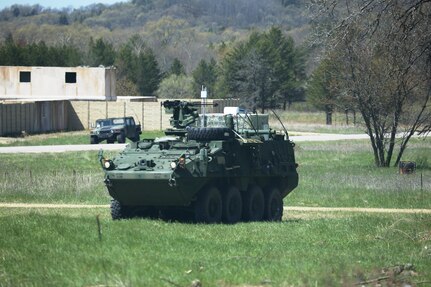 An Army Stryker vehicle and humvee are set up for use at Combat in the Cities Bullard training area on North Post during exercise operations for the 86th Training Division’s Warrior Exercise 86-17-02 on May 3, 2017, at Fort McCoy, Wis. Nearly 6,000 Soldiers participated in the Warrior Exercise that focuses on realistic and austere operational environments. The exercise is aimed at testing and developing leaders at every echelon. One of the key objectives for the 2017 Warrior Exercise was to enable units at the platoon level to succeed in a tactical environment when faced with the stressors of combat. (U.S. Army Photo by Scott T. Sturkol, Public Affairs Office, Fort McCoy, Wis.)