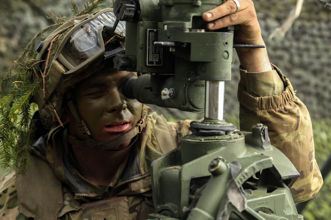 Army Sgt Jason Vikre adjusts the aim of a howitzer during the Saber Junction 17 exercise at Hohenfels Training Area, Germany, May 3, 2017. Saber Junction 17 is the U.S. Army Europe’s 2nd Cavalry Regiment’s certification exercise, taking place at the Joint Multinational Readiness Center. Vikre is assigned to the 2nd Cavalry Regiment. Army photo by Pfc. Zachery Perkins