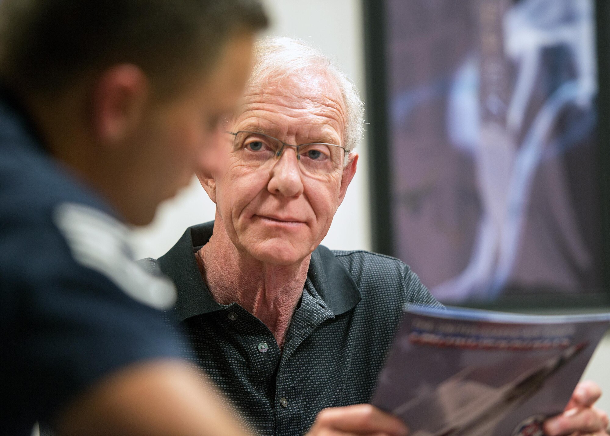 Former airline pilot, Chesley “Sully” Sullenberger III, receives a public affairs briefing from U.S. Air Force Staff Sgt. Jason Couillard, before his flight with the United States Air Force Thunderbirds at Travis Air Force Base, Calif., May 4, 2017. Sullenberger is a 1973 Air Force Academy graduate and is best known for successfully landing a crippled airliner in the Hudson River saving the lives of 155 passengers. (U.S. Air Force photo by Louis Briscese)