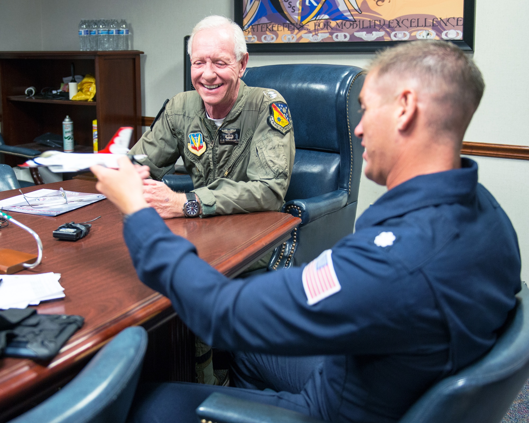 Former airline pilot Chesley “Sully” Sullenberger III and U.S. Air Force Lt. Col. Kevin Walsh, Thunderbirds pilot, go over some of the acrobatics that will be performed on Sullenberger's flight with the United States Air Force Thunderbirds at Travis Air Force Base, Calif., May 4, 2017. Sullenberger is a 1973 Air Force Academy graduate and is best known for successfully landing a crippled airliner in the Hudson River saving the lives of 155 passengers. (U.S. Air Force photo by Louis Briscese)