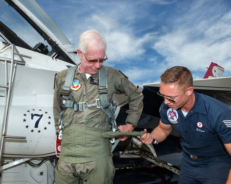 Former airline pilot, Chesley “Sully” Sullenberger III, puts on his G-suit before his flight with the United States Air Force Thunderbirds at Travis Air Force Base, Calif., May 4, 2017. Sullenberger is a 1973 Air Force Academy graduate and is best known for successfully landing a crippled airliner in the Hudson River saving the lives of 155 passengers. (U.S. Air Force photo by Louis Briscese)
