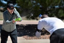 Chief Master Sgt. Steve Matthews and Staff Sgt. Andrew Skinner, both from the 50th Space Communications Squadron, engage in a water gun fight as part of the "Amazing gRace" competition during Wingman Day at Schriever Air Force Base, Colorado, Thursday, May 4, 2017. The event was one of a variety of team-focused activities Airmen engaged in during the day. (U.S. Air Force Photo/Dennis Rogers)