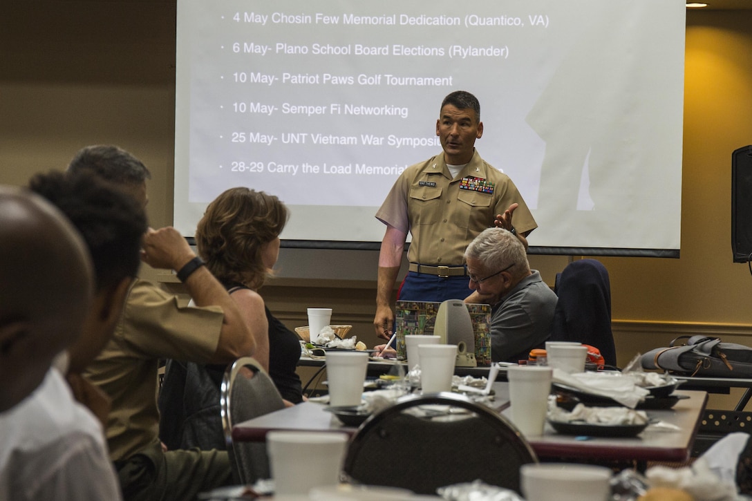 U.S. Marine Corps Col Keven W. Mathews, commanding officer of the 8th Marine Corps District, gives a brief to the Metroplex Marines over the Marine Corps Recruiting history of advertising campaigns on May 4, 2017. During his brief, Col. Matthews discussed the different approaches that are utilized in reaching different generations over the years. (U.S. Marine Corps photo by Cpl. Clarence A. Leake)
