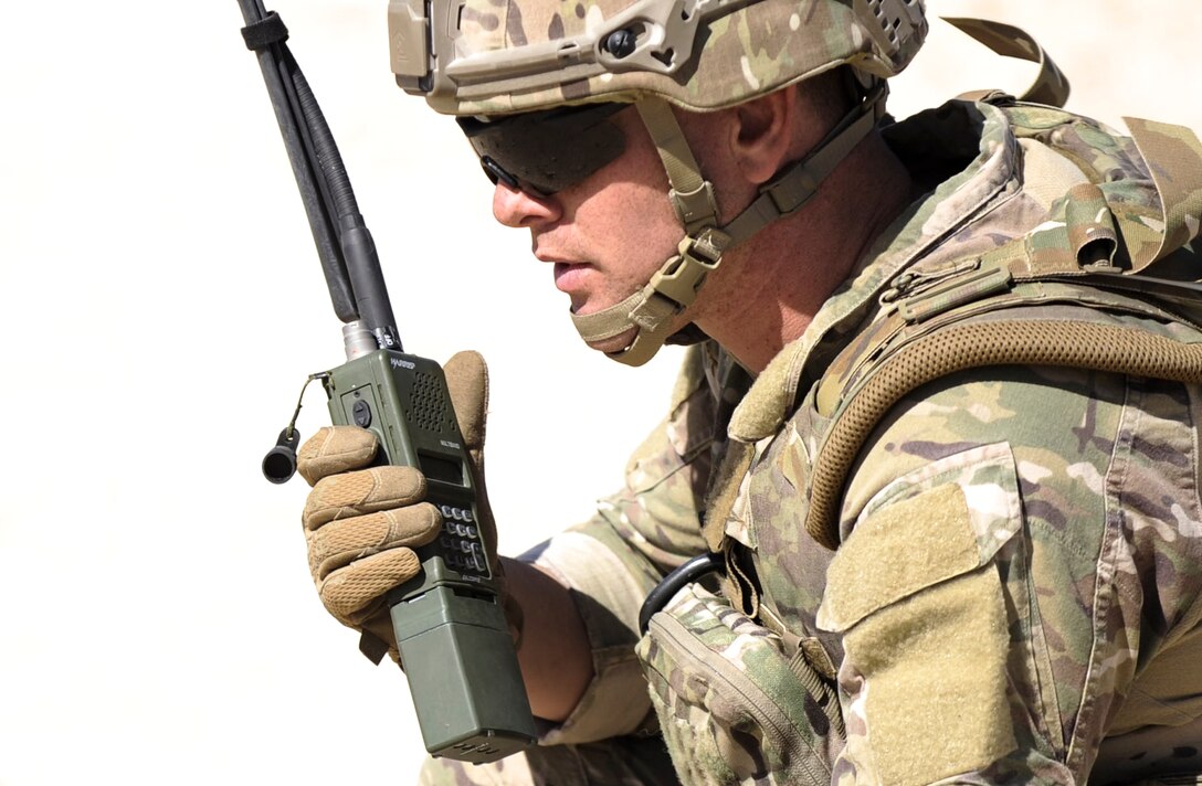 Staff Sgt. Christopher Eccard, 99th Civil Engineer Squadron explosive ordnance dispersal technician, uses a radio to communicate with other EOD teams during a training exercise on Nellis Air Force Base, Nev., May 3, 2017. EOD technicians are trained to detect, disarm, detonate and dispose explosive threats worldwide. (U.S. Air Force photo by Senior Airman Kevin Tanenbaum/Released)