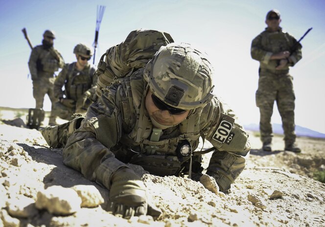 Tech. Sgt. Kenneth Westrum, 99th Civil Engineer Squadron explosive ordnance disposal technician, and his team search for a wire during a training operation on Nellis Air Force Base, Nev., May 3, 2017. EOD technicians are assigned to some of the most dangerous missions. They perform tactically harrowing and technically demanding tasks in diverse environments worldwide. (U.S. Air Force photo by Senior Airman Kevin Tanenbaum/Released)
