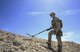 Staff Sgt. Kyle Osgood, 99th Civil Engineer Squadron explosive ordnance disposal technician, uses a metal detector to clear a perimeter during training exercises on Nellis Air Force Base, Nev., May 3, 2017. EOD technicians detect, identify, recover, disarm and dispose of unsafe explosives and ordnance. (U.S. Air Force photo by Senior Airman Kevin Tanenbaum/Released)