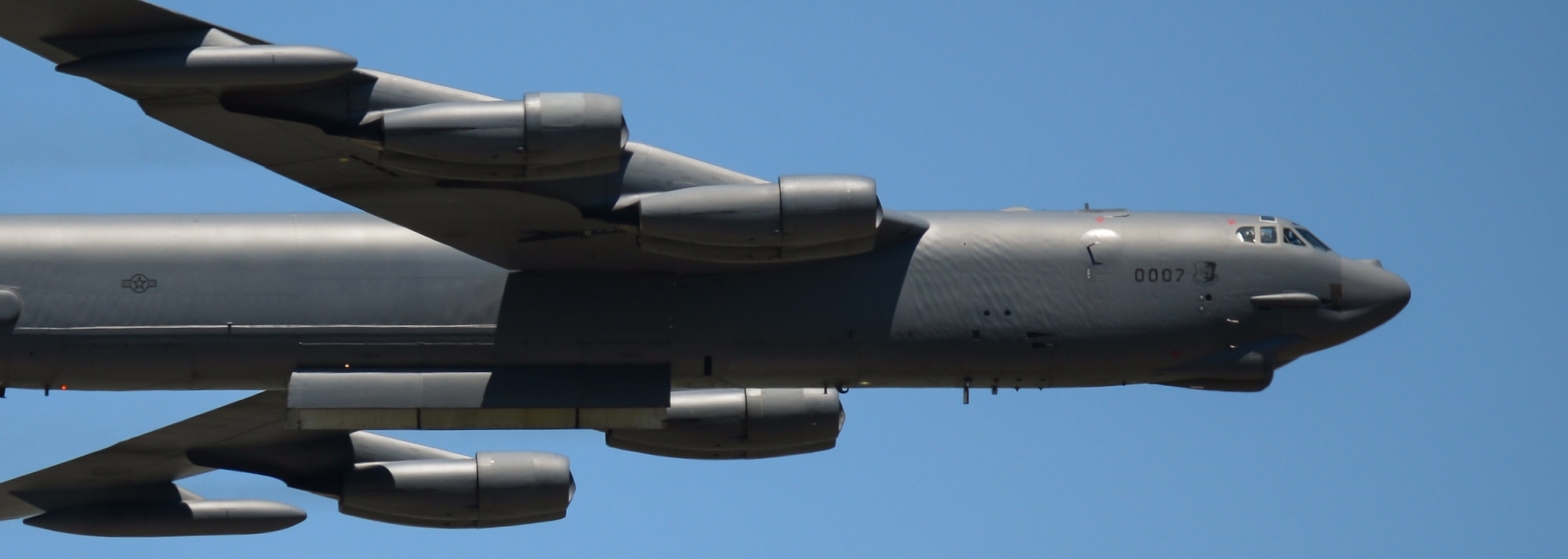 A B-52 Stratofortress flies at a low altitude with bomb bay doors open, performing a close-air support exercise during the 2017 Barksdale Air Force Base Airshow, May 7. The B-52 gave spectators an inside view of the bomb bay in a tribute to the B-52 combat operations in Iraq and Syria. (U.S. Air Force photo/Staff Sgt. Benjamin Raughton)