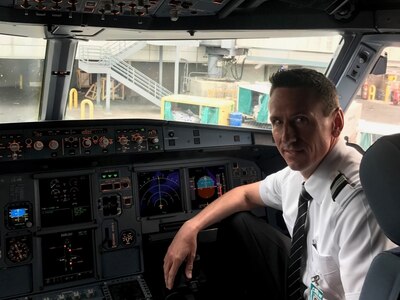 Airline pilot Ryan Scofield, pictured here in his cockpit, April 28, 2017, has flown for a commercial airline carrier for 12 years. When he's not in an Airbus A320, he’s piloting a C-130H Hercules aircraft for the Wyoming Air National Guard's 187th Airlift Squadron based in Cheyenne. 