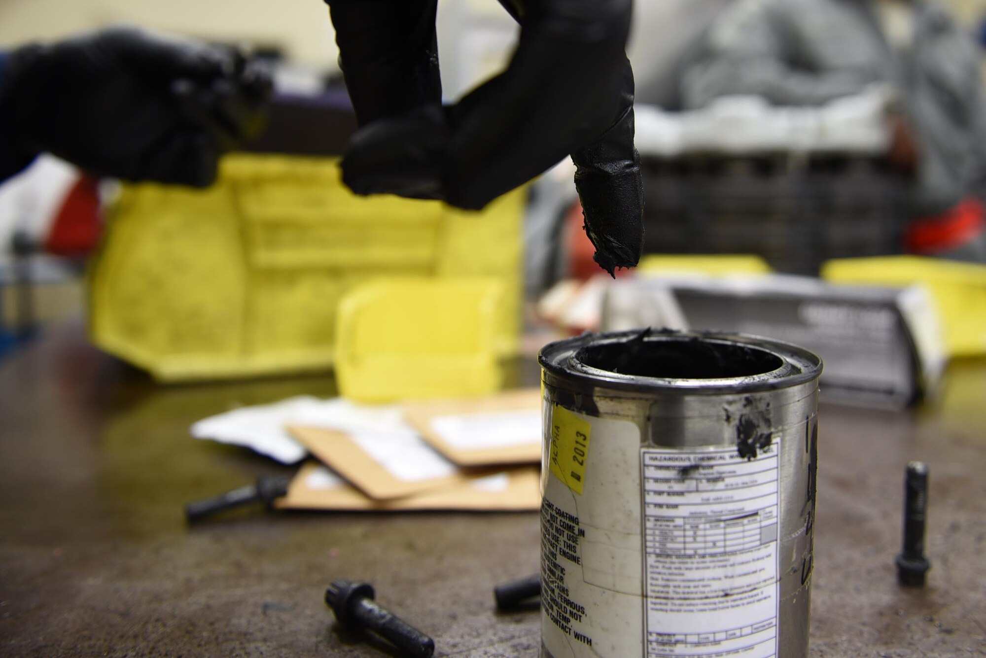 Senior Airman Osaro Obayuwana, 19th Aircraft Maintenance Squadron Hydraulics Centralized Repair Facility journeyman, applies an anti-seize lubricant to a brake housing bolt before installation May 2, 2017, at Little Rock Air Force Base, Ark. The substance prevents the bolts from clutching the brake housing due to extreme heat produced during operations. (U.S. Air Force photo by Airman 1st Class Kevin Sommer Giron)