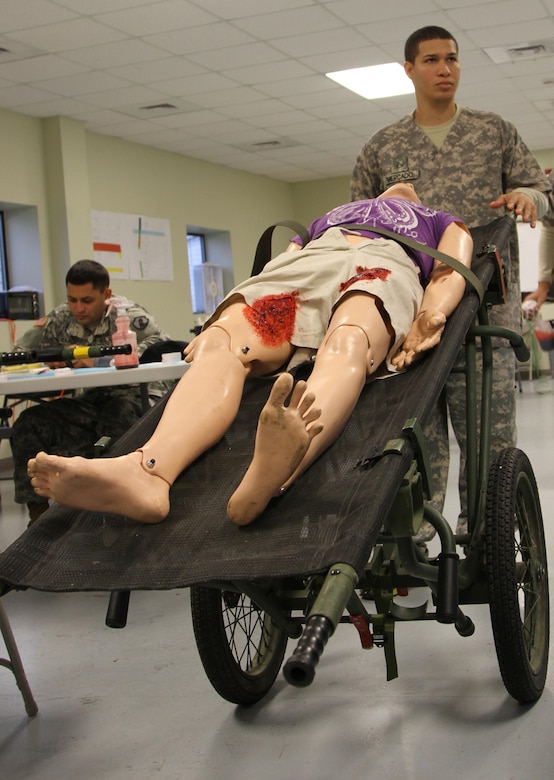 MUSCATATUCK URBAN TRAINING CENTER, Indiana (May 5, 2017) – Pfc. Angel Mercado from Sabana Grande, Puerto Rico, an ammunition specialist with the U.S. Army Reserve’s 266th Ordnance Company, carts off a mannequin dressed as a casualty to be used in the U.S. Army Reserve’s Guardian Response 17 at the Muscatatuck Urban Training Center (MUTC), Indiana, May 5, 2017. Nearly 4,100 Soldiers from across the country are participating in Guardian Response 17, a multi-component training exercise to validate U.S. Army units’ ability to support the Defense Support of Civil Authorities (DSCA) in the event of a Chemical, Biological, Radiological, and Nuclear (CBRN) catastrophe.