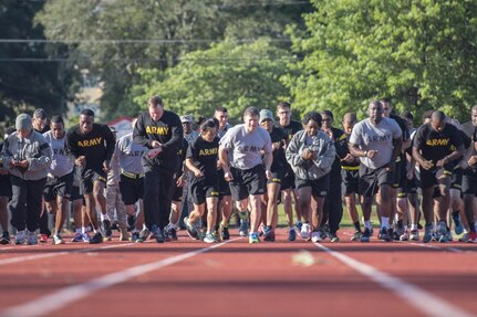 U.S. Army Reserve Soldiers with the 335th Signal Command (Theater) begin the two-mile run event of the Army Physical Fitness Test on a track in East Point, Ga., May 6, 2017. The APFT is designed to test the muscular strength, endurance, and cardiovascular respiratory fitness of soldiers in the Army. Soldiers are scored based on their performance in three events consisting of the push-up, sit-up, and a two-mile run, ranging from 0 to 100 points in each event. (U.S. Army Reserve photo by Staff Sgt. Ken Scar)