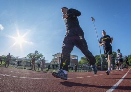 U.S. Army Reserve Sgt. 1st Class Brent Powell, a public affairs noncommissioned officer for the 335th Signal Command (Theater) from Pocahontas, Ark., runs two miles to pass the Army Physical Fitness Test at Woodward Academy in East Point, Ga., May 6, 2017. The APFT is designed to test the muscular strength, endurance, and cardiovascular respiratory fitness of soldiers in the Army. Soldiers are scored based on their performance in three events consisting of the push-up, sit-up, and a two-mile run, ranging from 0 to 100 points in each event. (U.S. Army Reserve photo by Staff Sgt. Ken Scar)