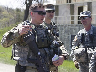 U.S. Army Reserve 2nd Lt. Garrett Bridenbaugh from the 341st Engineer Company recounts key actions by his unit after their iteration through a convoy operations training lane on Fort McCoy, Wis., as part of Warrior Exercise 86-17-02, May 3, 2017. More than 70 U.S. Army Reserve units conducted combat training to increase their lethality as cohesive units of action during the 84th Training Command’s WAREX 86-17-02 at Fort McCoy, Wis. from late April through mid-May 2017. (U.S. Army Reserve photo by Sgt. Beth Raney, 343rd Mobile Public Affairs Detachment)