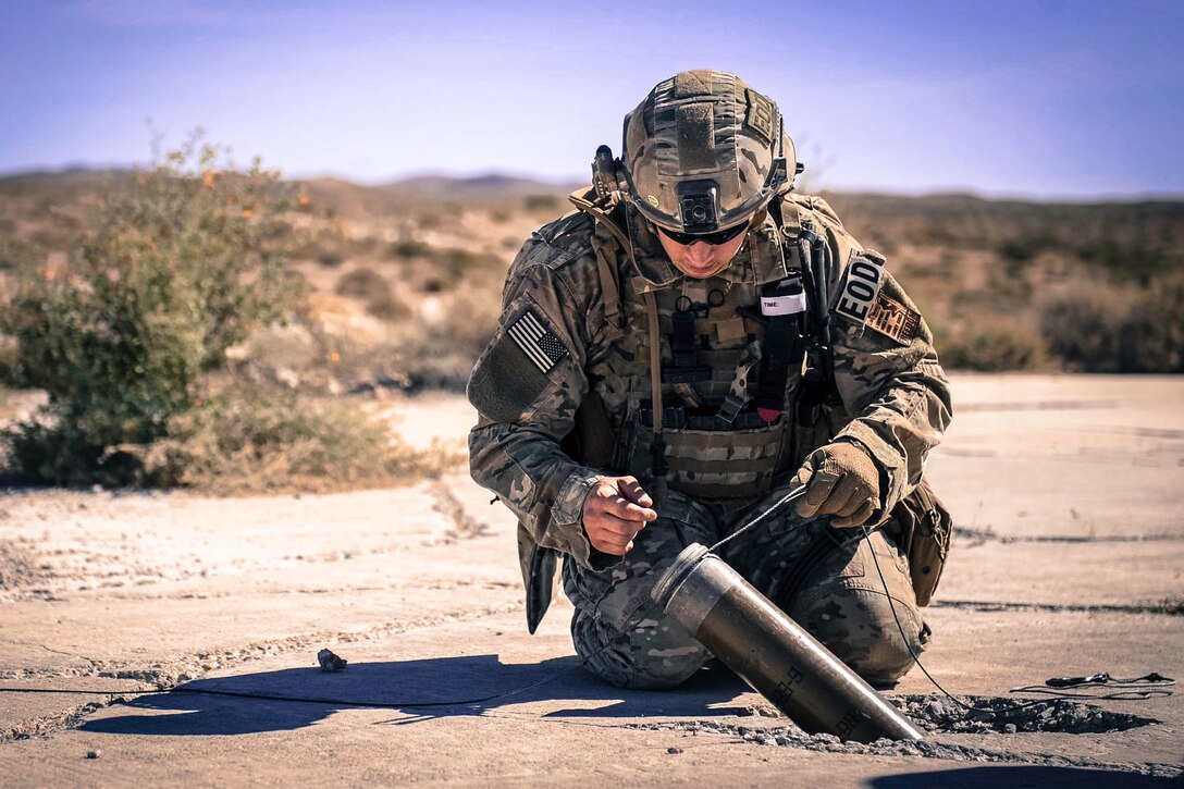 Air Force Staff Sgt. Kyle Osgood secures a simulated rocket during a training exercise at Nellis Air Force Base, Nev., May 3, 2017. Air Force photo by Senior Airman Kevin Tanenbaum