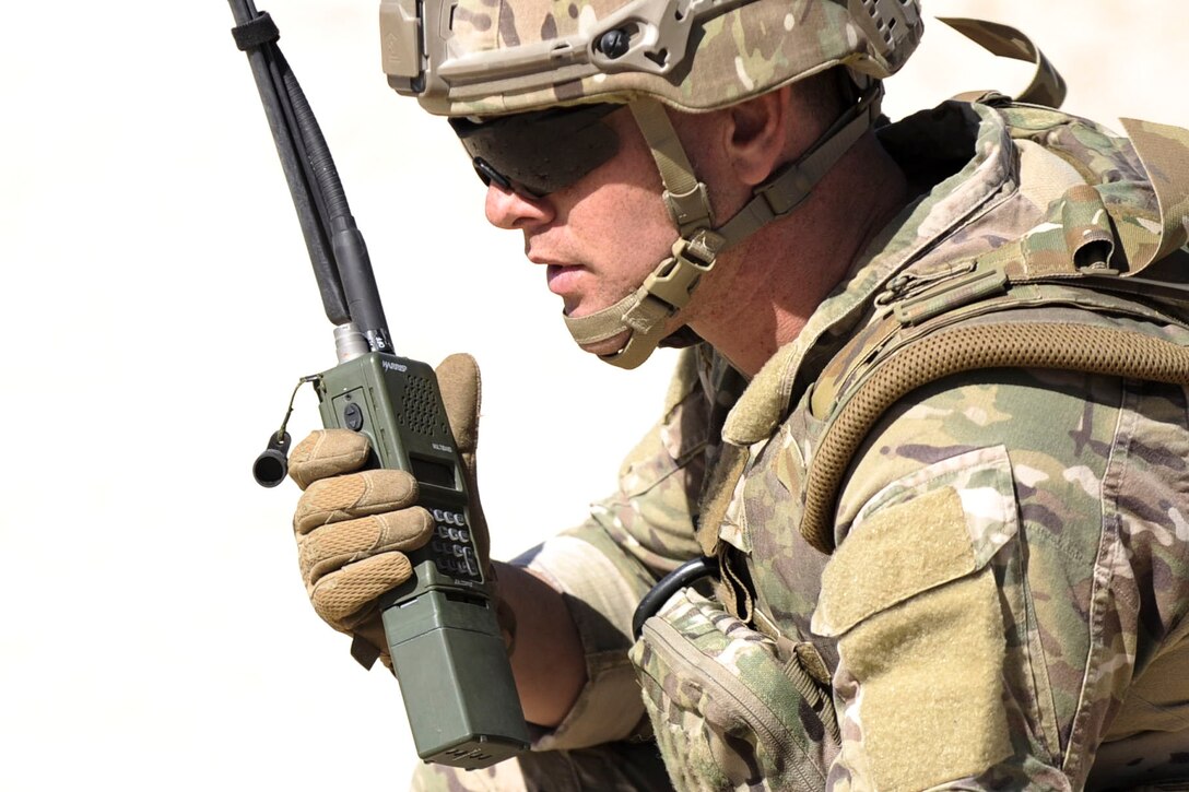 Air Force Staff Sgt. Christopher Eccard communicates with members of other explosive ordnance disposal teams during a training exercise at Nellis Air Force Base, Nev., May 3, 2017. Military EOD troops are trained to detect, disarm, detonate and dispose of explosives. Eccard is assigned to the 99th Civil Engineer Squadron. Air Force photo by Senior Airman Kevin Tanenbaum