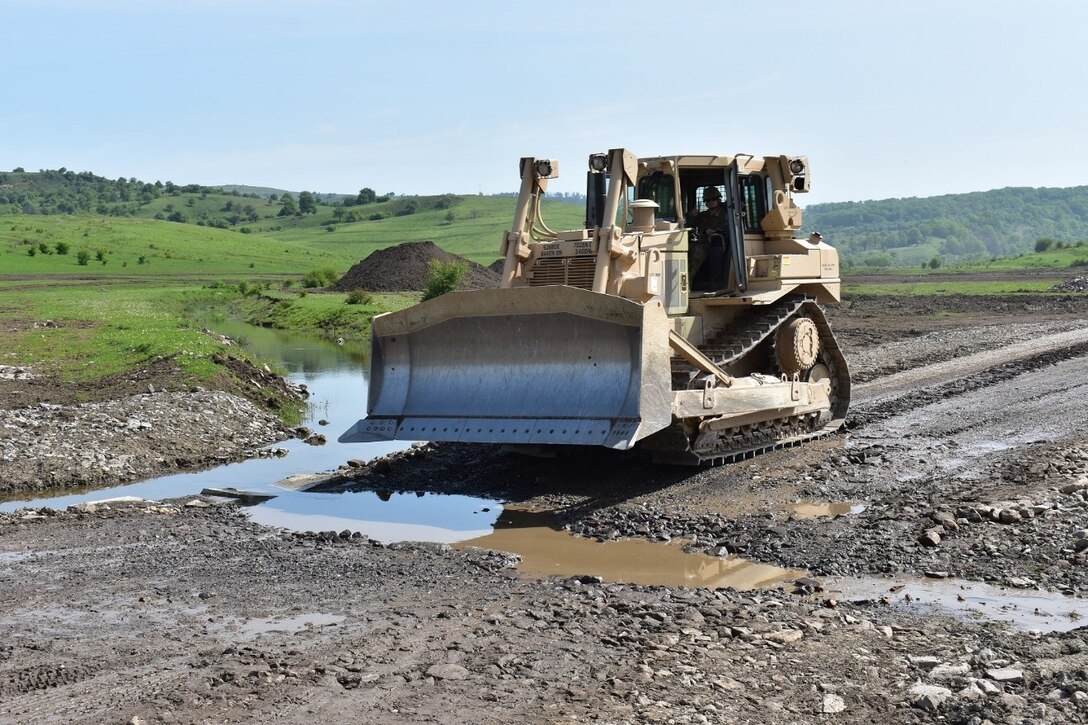 A bulldozer uses the low-water crossing at the Non-Standard Live-fire Range at Joint National Training Center, Cincu, Romania, as part of Resolute Castle 17.  Resolute Castle 17 is an exercise strengthening the NATO alliance and enhancing its capacity for joint training and response to threats within the region.