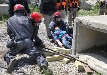 Army Reserve units hit the ground running at Muscatatuck Urban Training Center, Indiana, as the second phase of Guardian Response 17 kicked off. Soldiers from the 468th Fire Fighting Detachment suited up and surveyed the area before searching and extracting casualties of a simulated nuclear attack on May 06, 2017. 

Nearly 5,000 Soldiers and Airmen from across the country are participating in Guardian Response 17, a multi-component training exercise to validate the military's ability to support Civil Authorities in the event of a Chemical, Biological, Radiological, and Nuclear (CBRN) catastrophe. (U.S. Army Reserve photo by Staff Sgt. Christopher Sofia/Released)