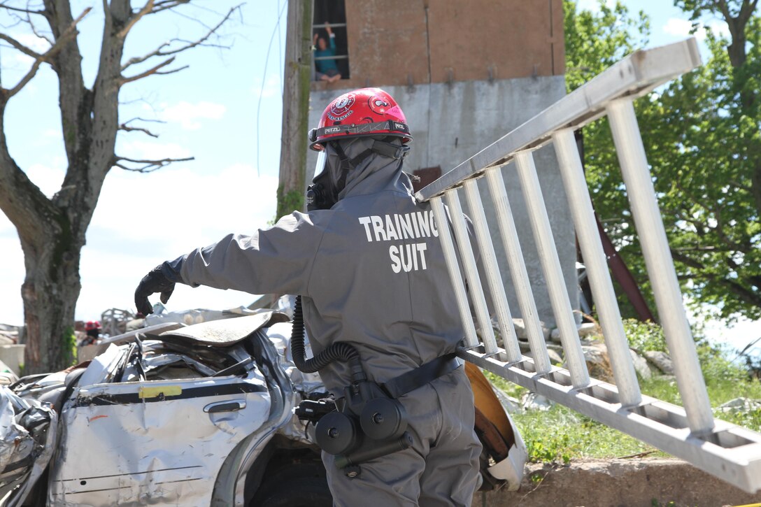 Army Reserve units hit the ground running at Muscatatuck Urban Training Center, Indiana, as the second phase of Guardian Response 17 kicked off on Saturday, May 06, 2017. Soldiers from the 468th Fire Fighting Detachment suited up and surveyed the area before searching and extracting casualties of the simulated nuclear attack. 

Nearly 5,000 Soldiers and Airmen from across the country are participating in Guardian Response 17, a multi-component training exercise to validate the military's ability to support Civil Authorities in the event of a Chemical, Biological, Radiological, and Nuclear (CBRN) catastrophe. (U.S. Army Reserve photo by Staff Sgt. Christopher Sofia/Released)