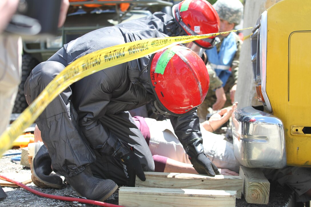 Army Reserve units hit the ground running at Muscatatuck Urban Training Center, Indiana, as the second phase of Guardian Response 17 kicked off on Saturday, May 06, 2017. Soldiers from the 468th Fire Fighting Detachment suited up and surveyed the area before searching and extracting casualties of the simulated nuclear attack. 

Nearly 5,000 Soldiers and Airmen from across the country are participating in Guardian Response 17, a multi-component training exercise to validate the military's ability to support Civil Authorities in the event of a Chemical, Biological, Radiological, and Nuclear (CBRN) catastrophe. (U.S. Army Reserve photo by Staff Sgt. Christopher Sofia/Released)