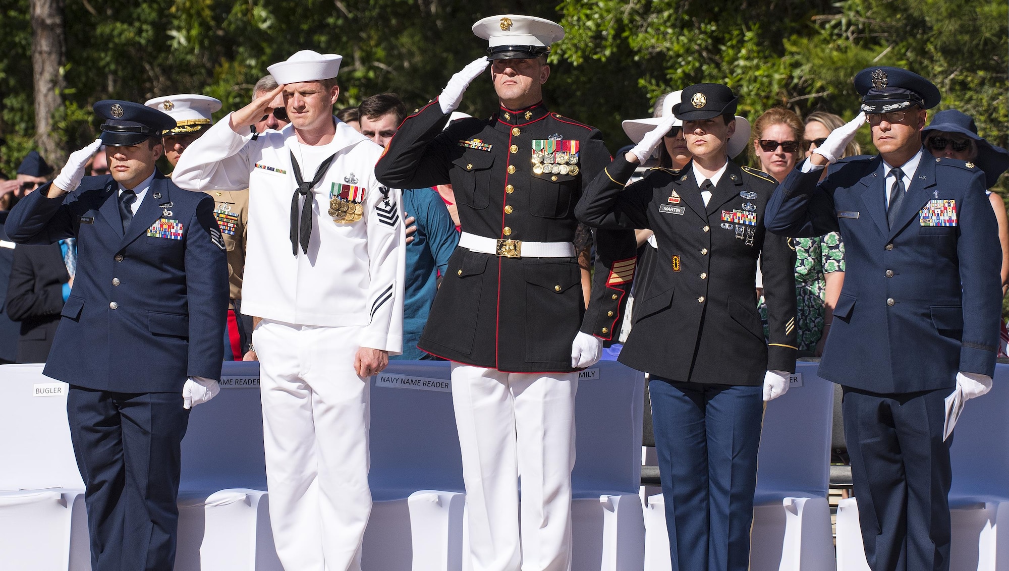 Airmen, Sailors, Marines and Soldiers salute during the presentation of the colors at the 48th Annual Explosive Ordnance Disposal Memorial Service at the Kauffman EOD Training Complex at Eglin Air Force Base, Fla., May 6. Names of recent fallen and past EOD technicians are added to the memorial wall during a ceremony each year. The Army and Navy added six new names this year. The all-service total now stands at 326. (U.S. Air Force photo/ Samuel King Jr.)