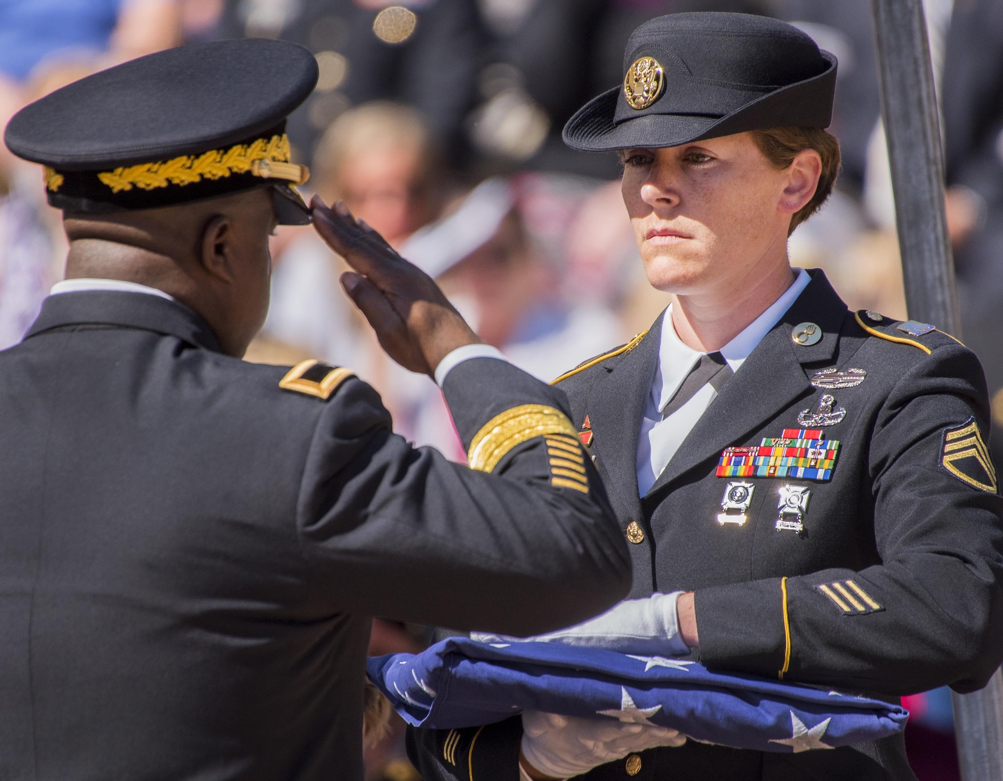 Brig. Gen. David Wilson, U.S. Army Ordnance School commandant, salutes before receiving a folded American flag during the 48th Annual Explosive Ordnance Disposal Memorial Service, May 6. Names of recent fallen and past EOD technicians are added to the memorial wall during a ceremony each year at the Kauffman EOD Training Complex at Eglin Air Force Base, Fla. The Army and Navy added six new names this year. The all-service total now stands at 326. (U.S. Air Force photo/ Samuel King Jr.)