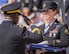 Brig. Gen. David Wilson, U.S. Army Ordnance School commandant, salutes before receiving a folded American flag during the 48th Annual Explosive Ordnance Disposal Memorial Service, May 6. Names of recent fallen and past EOD technicians are added to the memorial wall during a ceremony each year at the Kauffman EOD Training Complex at Eglin Air Force Base, Fla. The Army and Navy added six new names this year. The all-service total now stands at 326. (U.S. Air Force photo/ Samuel King Jr.)