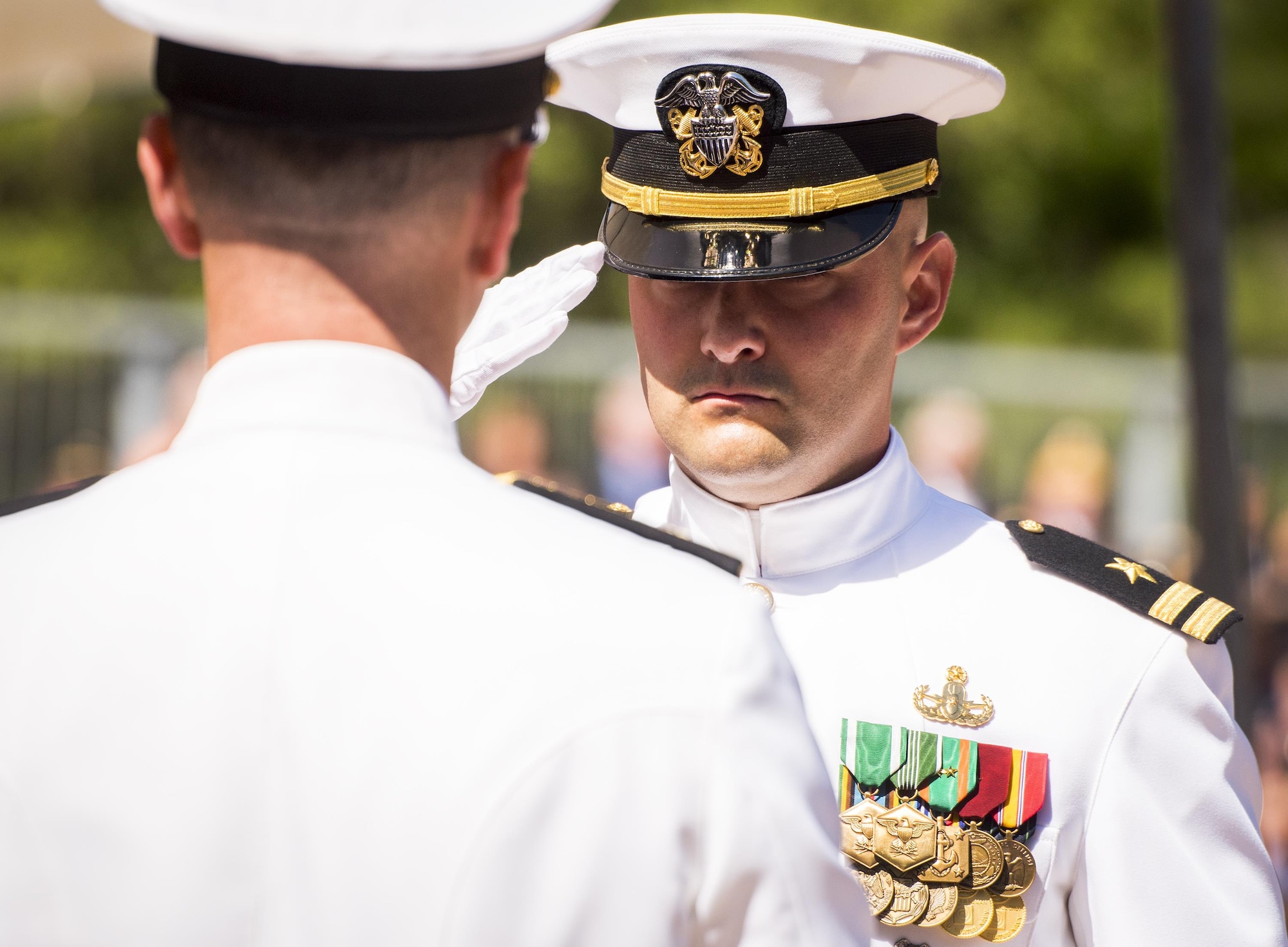 A Sailor salutes after presenting a flag during the 48th Annual Explosive Ordnance Disposal Memorial Service, May 6. Names of recent fallen and past EOD technicians are added to the memorial wall and flags presented to their families during a ceremony each year at the Kauffman EOD Training Complex at Eglin Air Force Base, Fla. The Army and Navy added six new names this year. The all-service total now stands at 326. (U.S. Air Force photo/ Samuel King Jr.)