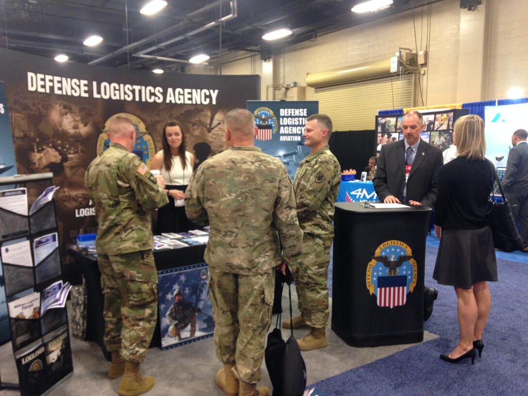 Defense Logistics Agency Aviation, Army Customer Facing Division soldiers and civilian employees answer customers' supportability questions April 27, 2017 at DLA's exhibit during the 2017 Army Aviation Mission Solutions Summit at the Gaylord Opryland Resort and Convention Center in Nashville, Tennessee. 