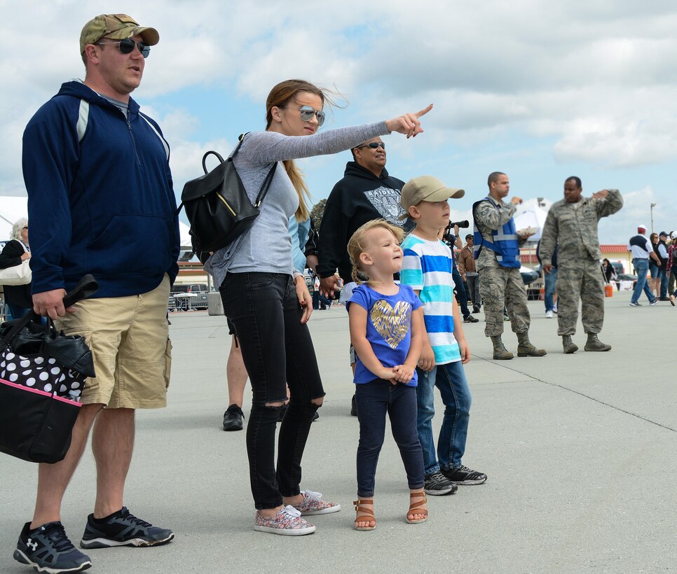 Crowds watch an aerial performer at Wings Over Solano, the Travis Air Show, at Travis Air Force Base, Calif., on May 6, 2017. The two-day event featured performances by the U.S. Army Golden Knights, Thunderbirds, flyovers and static displays. (U.S. Air Force photo by Staff Sgt. Daniel Phelps)