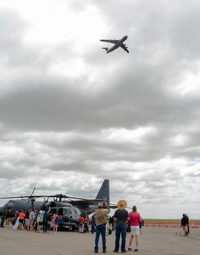 Crowds watch a fly over of a C-5M Super Galaxy at Wings Over Solano, the Travis Air Show, at Travis Air Force Base, Calif., on May 6, 2017. The two-day event featured performances by the U.S. Army Golden Knights, Thunderbirds, flyovers and static displays. (U.S. Air Force photo by Staff Sgt. Daniel Phelps)