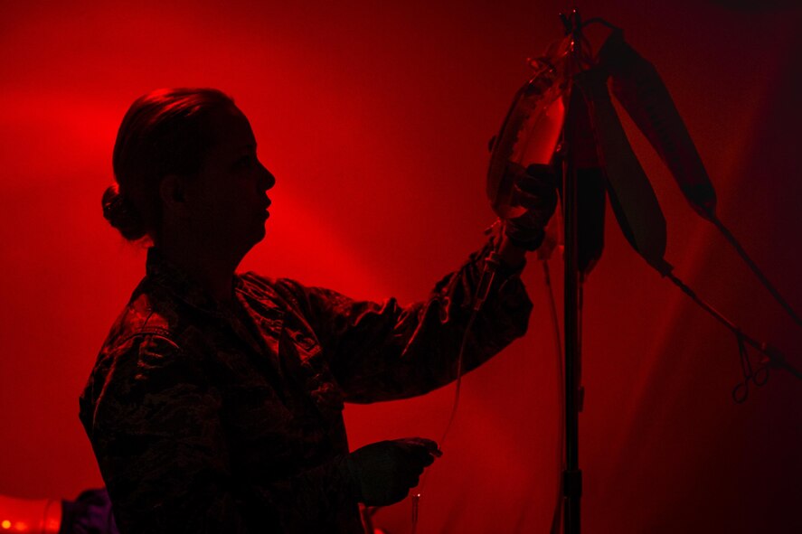 Lt. Col. Heather Perez, 23d Medical Operation Support Squadron commander and chief of nursing, hangs an intravenous bag, May 5, 2017, at Moody Air Force Base, Ga. As Moody's chief nurse, Perez is in charge of approximately 300 nurses and medical technicians. She uses her vast nursing experiences to improve medical processes, ensure patient safety, and manage education and training. (U.S. Air Force photo by Senior Airman Ceaira Young)