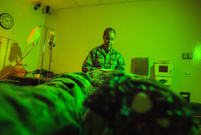 Lt. Col. Heather Perez, 23d Medical Operation Support Squadron commander and chief of nursing, assesses a simulated patient, May 2, 2017, at Moody Air Force Base, Ga. As Moody's chief nurse, Perez is in charge of approximately 300 nurses and medical technicians. She uses her vast nursing experiences to improve medical processes, ensure patient safety, and manage education and training. (U.S. Air Force photo by Senior Airman Ceaira Young)