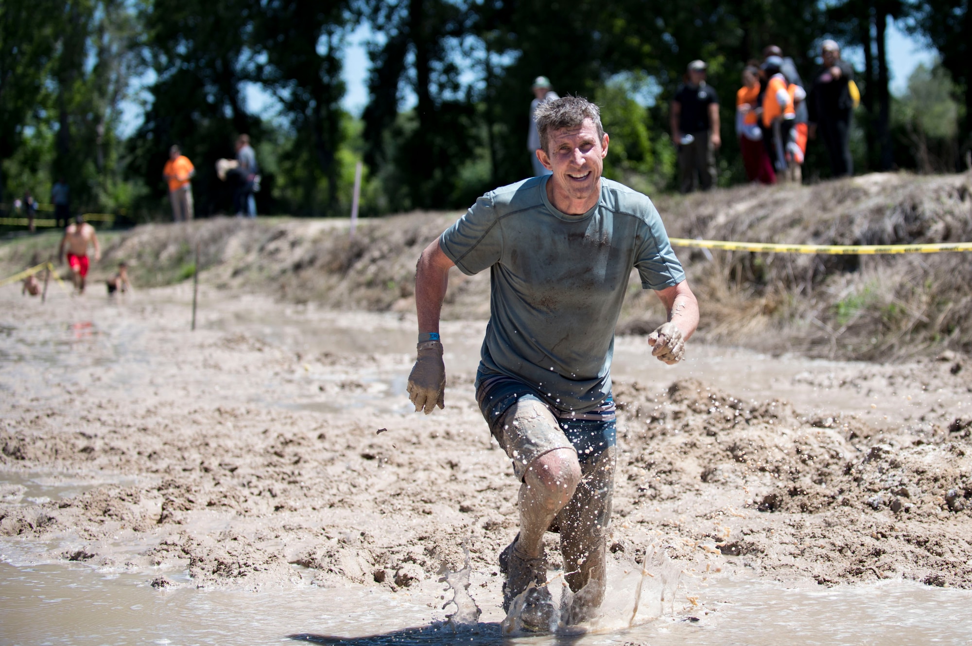Col. Thomas Kunkel, 23d Wing commander, completes the last obstacle during the annual Moody Mud Run, May 6, 2017, in Ray City, Ga. The Fourth Annual Moody Mud consisted of both adult and child course that challenged more than 600 participants with obstacles over 4.2 miles. (U.S. Air Force photo by Airman 1st Class Daniel Snider)