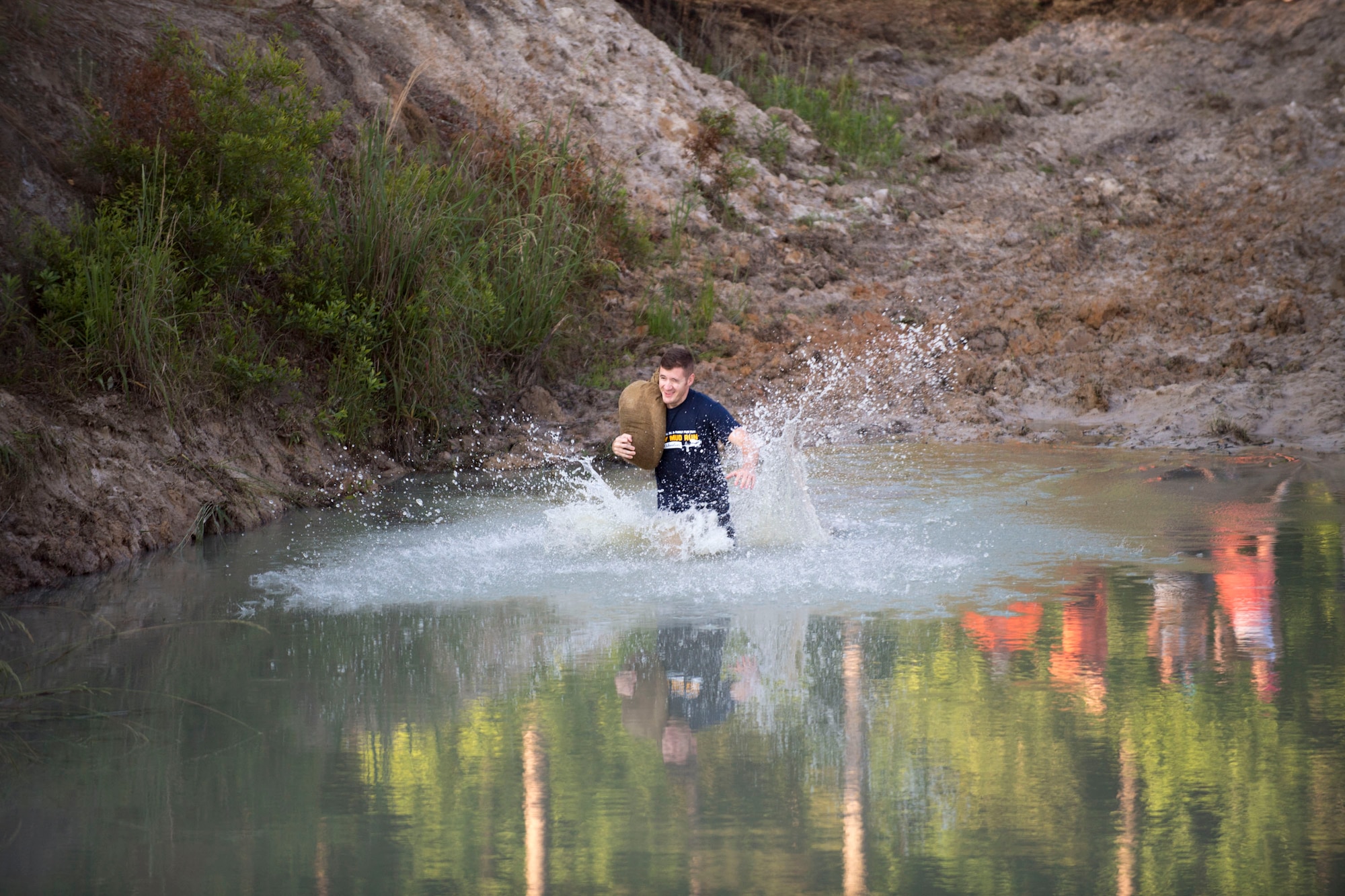 A participant begins the annual Moody Mud Run, May 6, 2017, in Ray City, Ga. The Fourth Annual Moody Mud consisted of both adult and child course that challenged more than 600 participants with obstacles over 4.2 miles. (U.S. Air Force photo by Airman 1st Class Daniel Snider)