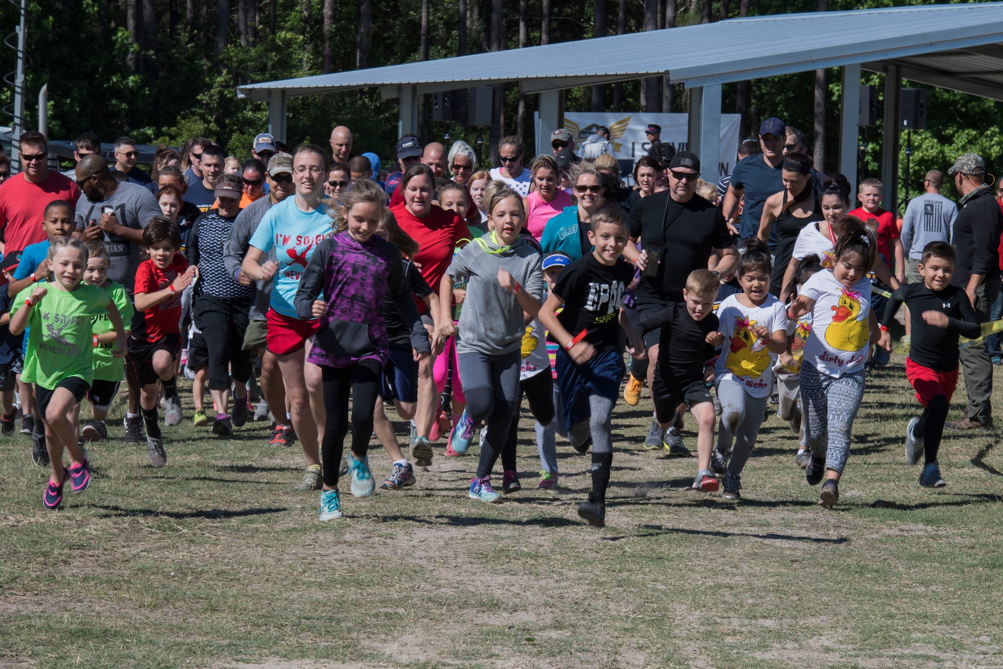 Children take-off from the starting line to begin the Child’s Moody Mud Run, May 6, 2017, in Ray City, Ga. The Fourth Annual Moody Mud consisted of both adult and child course that challenged more than 600 participants with obstacles over 4.2 miles. (U.S. Air Force photo by Staff Sgt. Eric Summers Jr.)