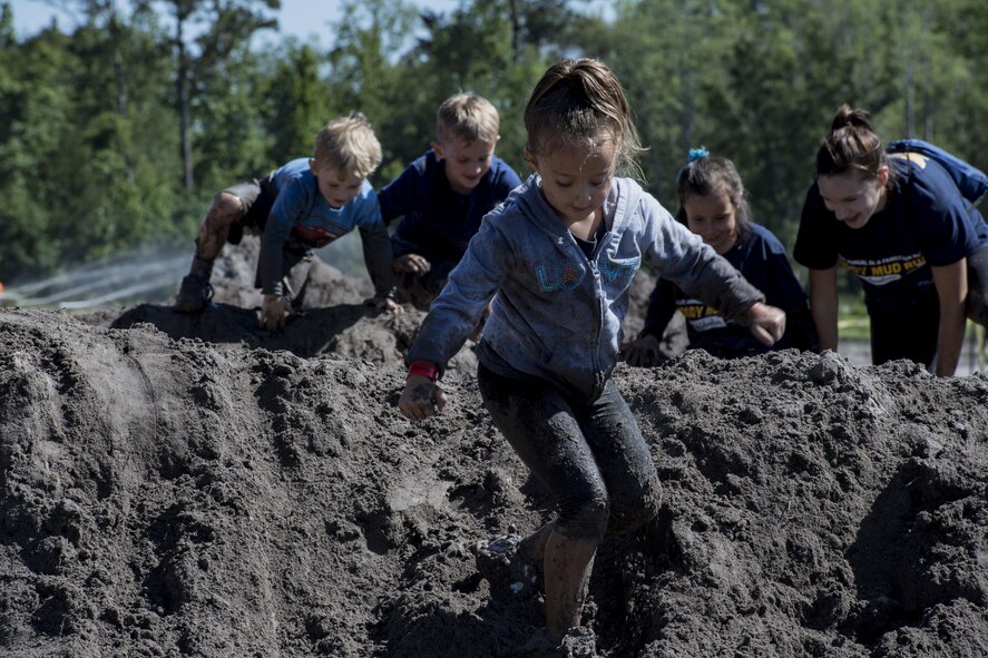 A participant of the Moody Mud Run children’s course treks down a hill, May 6, 2017, in Ray City, Ga. The Fourth Annual Moody Mud consisted of both adult and child course that challenged more than 600 participants with obstacles over 4.2 miles. (U.S. Air Force photo by Staff Sgt. Eric Summers Jr.)