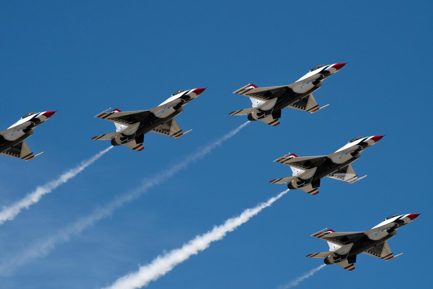 The United States Air Force Thunderbirds arrive at Travis Air Force Base, Calif., May 4, 2017. Shortly after arriving, the Thunderbirds flew with former airline pilot and Air Force Academy graduate Chesley "Sully" Sullenberger III. The Thunderbirds performed in the Wings Over Solano air show, the two-day event also featured skydiving by the U.S. Army Golden Knights parachute team, flyovers and static displays. (U.S. Air Force photo by Louis Briscese)