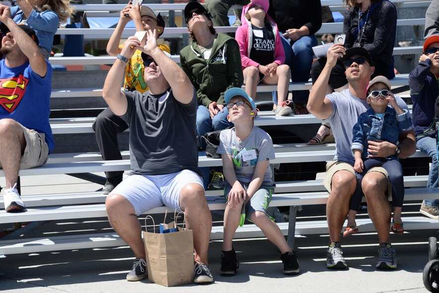Make-A-Wish families watch from the bleachers as the U.S. Air Force Thunderbirds practice their aerial demonstrations May 5, 2017 prior to the Wings Over Solano Air Show at Travis Air Force Base, Calif. The two-day event featured performances by the Thunderbirds, flyovers and static displays.(U.S. Air Force photo by Senior Airman Amber Carter)

