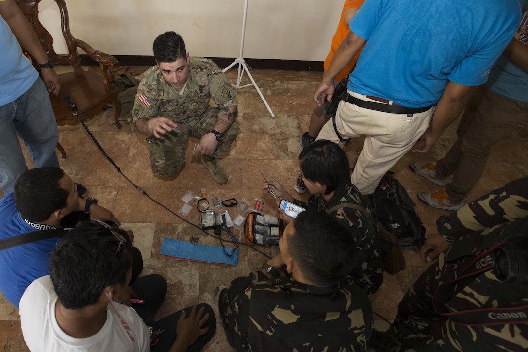 U.S. Army Staff Sgt. Jordan Curtis shows how to operate emergency equipment to members of several Philippine disaster relief agencies during a subject matter expert exchange for Balikatan 2017 on Fort Magsaysay in Santa Rosa, Nueva Ecija, May 4, 2017. Balikatan is an annual U.S.-Philippine bilateral military exercise focused on a variety of missions including humanitarian and disaster relief, counterterrorism, and other combined military operations. 