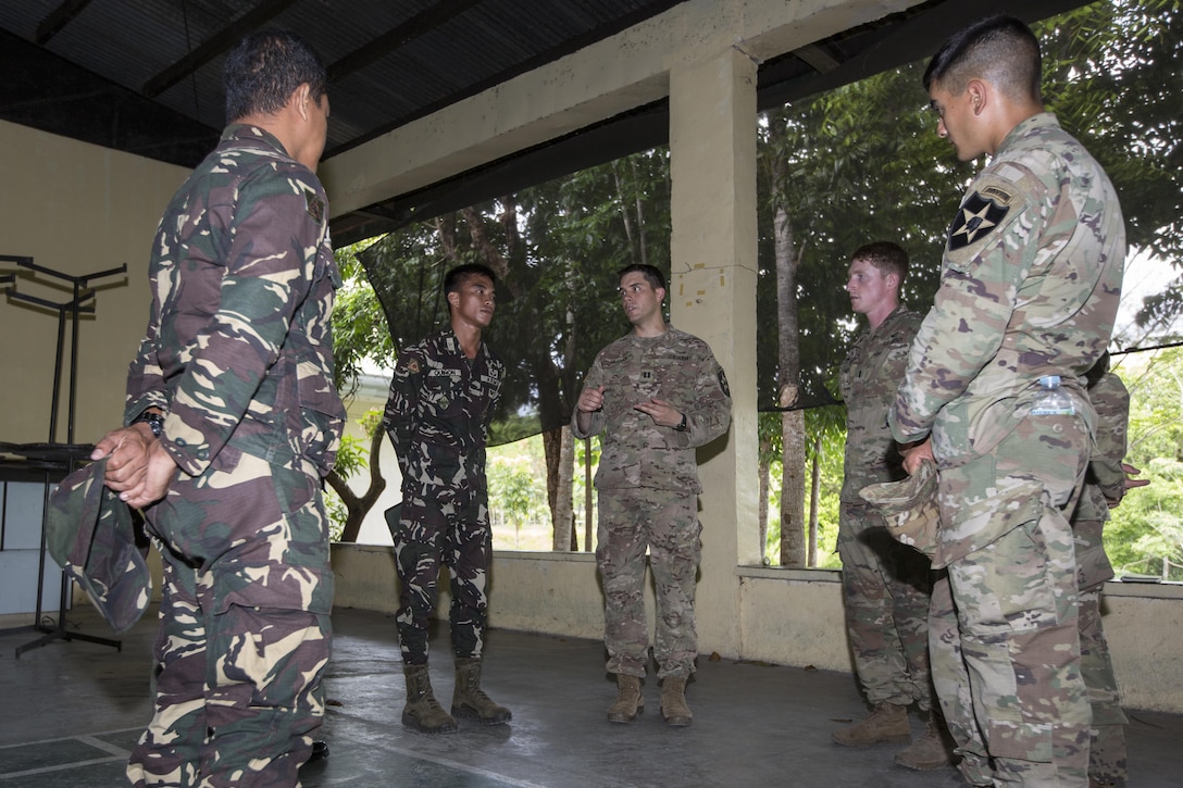 Philippine and U.S. service members meet and discuss bilateral training plans for Balikatan 2017 at Ft. Magsaysay in Santa Rosa, Nueva Ecija, May 5, 2017. Balikatan is an annual U.S.-Philippine bilateral military exercise focused on a variety of missions including humanitarian and disaster relief, counterterrorism, and other combined military operations. 