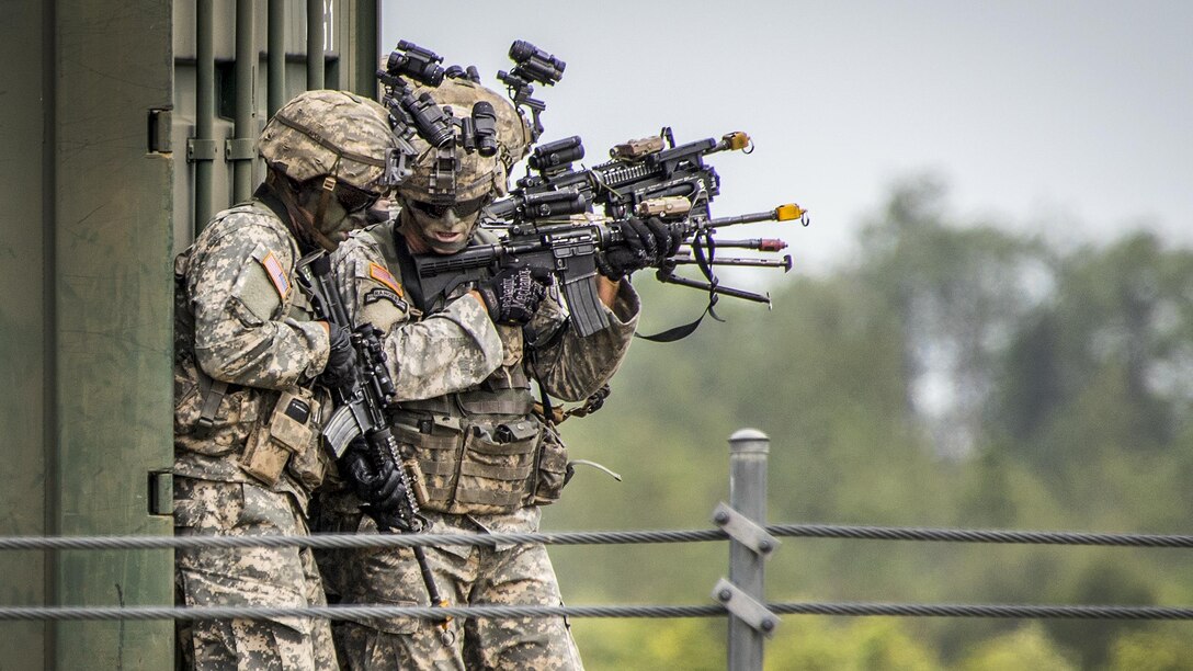 Army Rangers prepare to enter a building during a demonstration at the 6th Ranger Training Battalion’s open house at Eglin Air Force Base, Fla., April 29, 2017 The event showed hand-to-hand combat, a parachute jump, snake show and Rangers in action. Air Force photo by Samuel King Jr.