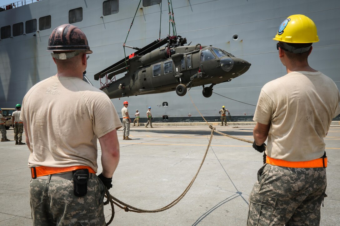 U.S. Soldiers guide a UH-60 Black Hawk off USNS Fisher (T-AKR 301) during port operations in support of Balikatan 2017 at Subic Bay, Zambales, May 1, 2017. Balikatan is an annual U.S.-Philippine bilateral military exercise focused on a variety of missions, including humanitarian assistance and disaster relief, counterterrorism, and other combined military operations. 